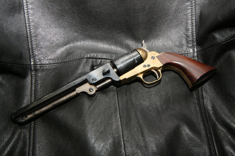 Revolver on leather surface