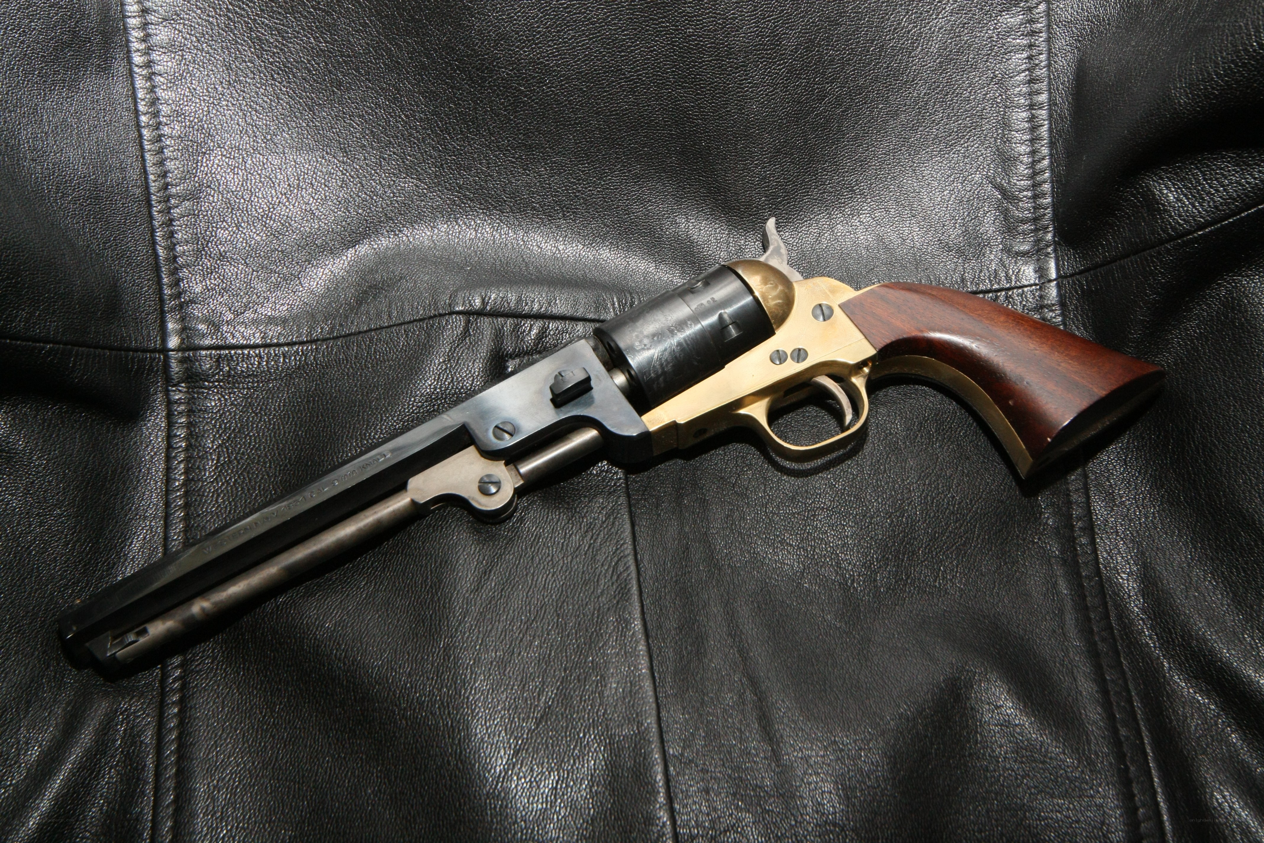 Revolver on leather surface