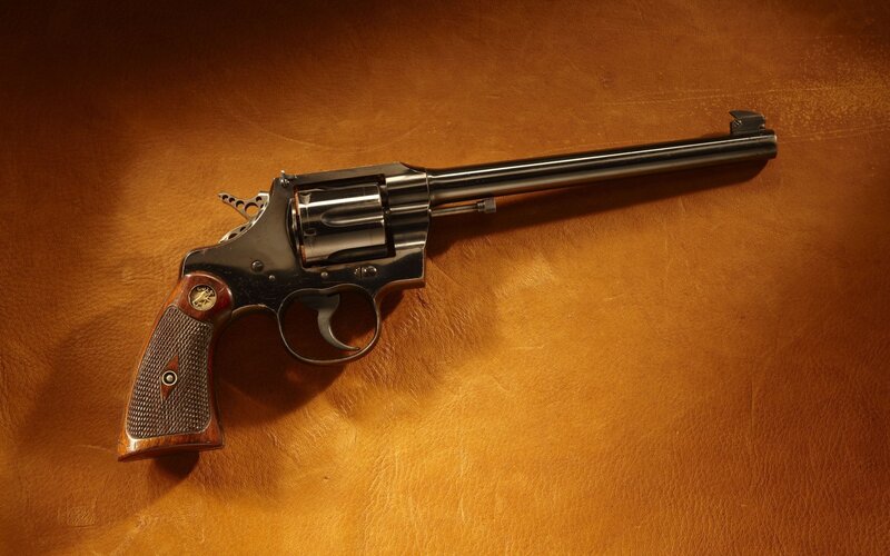 Revolver on leather surface