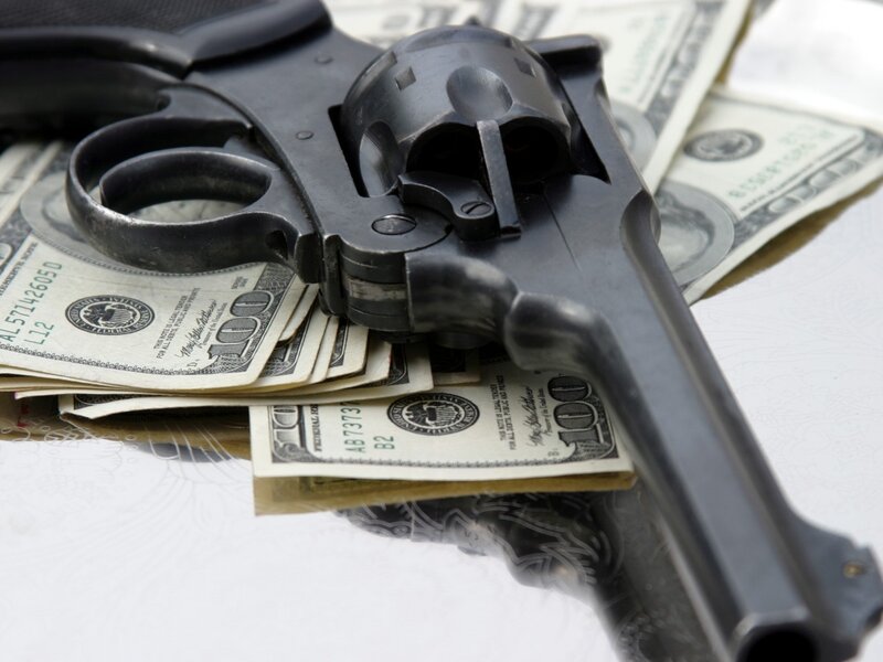 Revolver on money stack