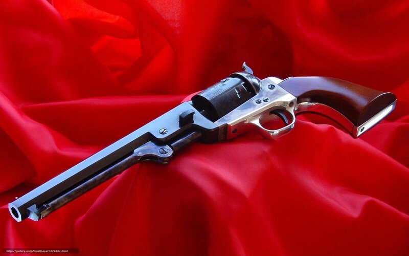 revolver on red fabric