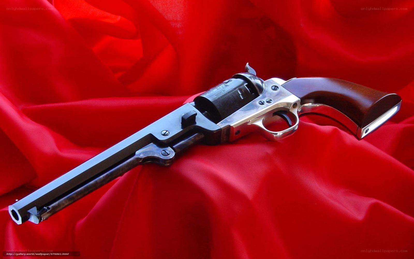 revolver on red fabric