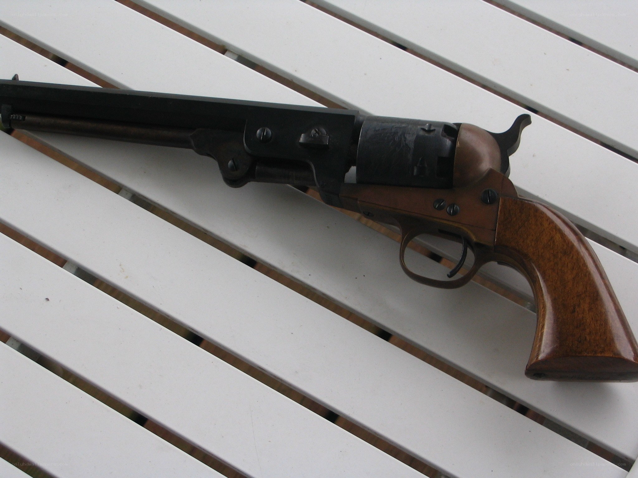 revolver on white slatted surface