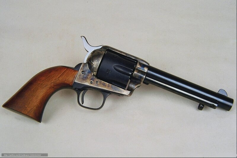 Revolver on White Surface — Brown