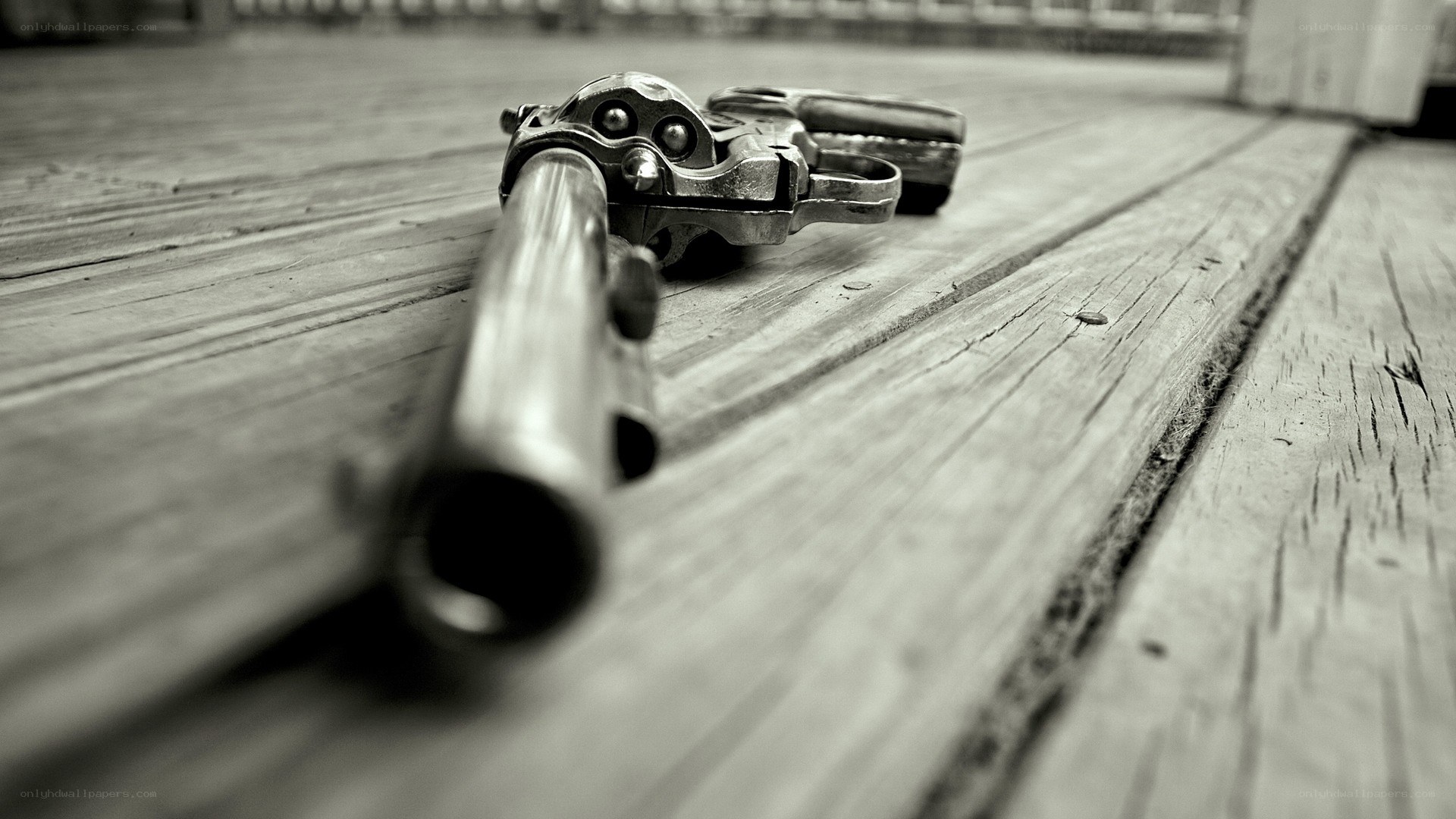 revolver on wooden surface