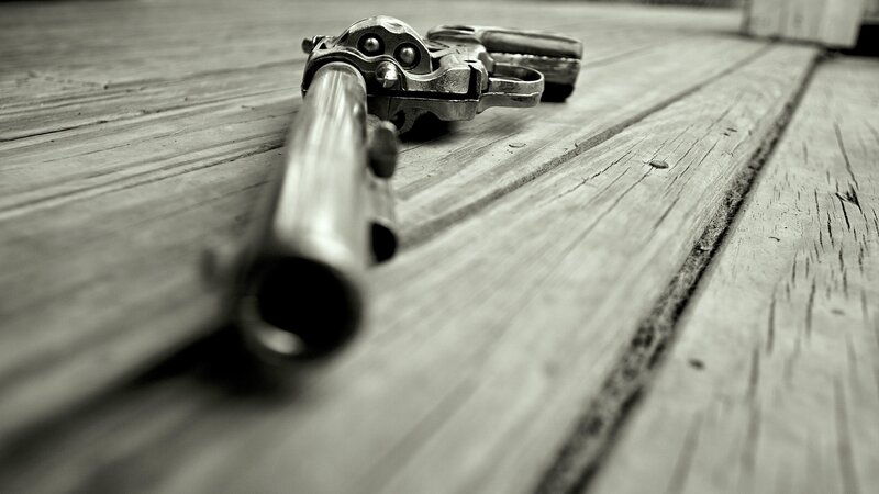 Revolver on Wooden Surface — Black