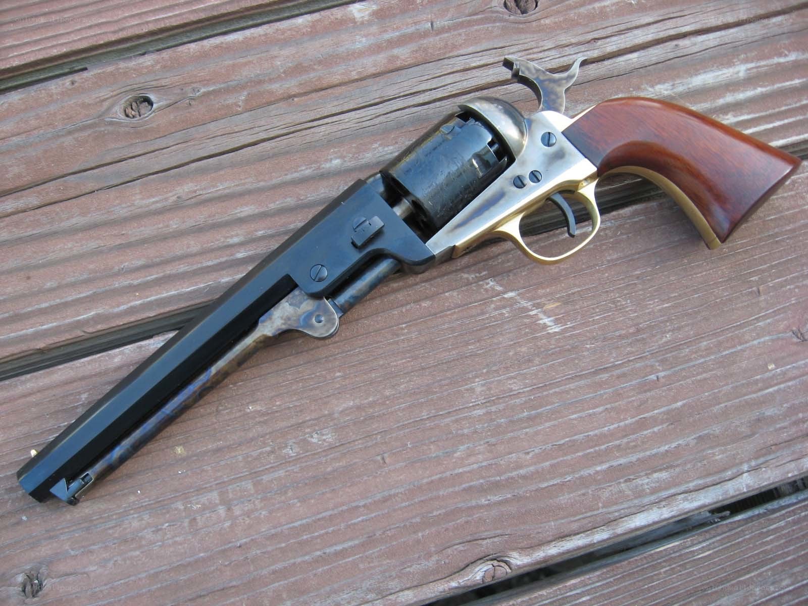 revolver on wooden surface