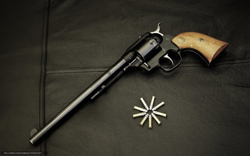 revolver with bullets on leather