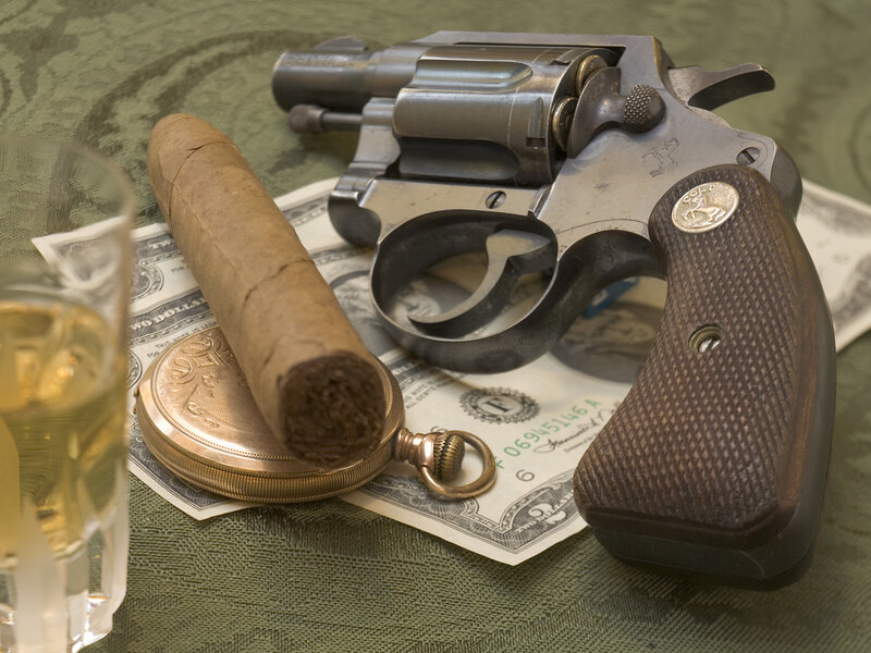 Revolver with cigar and pocket watch