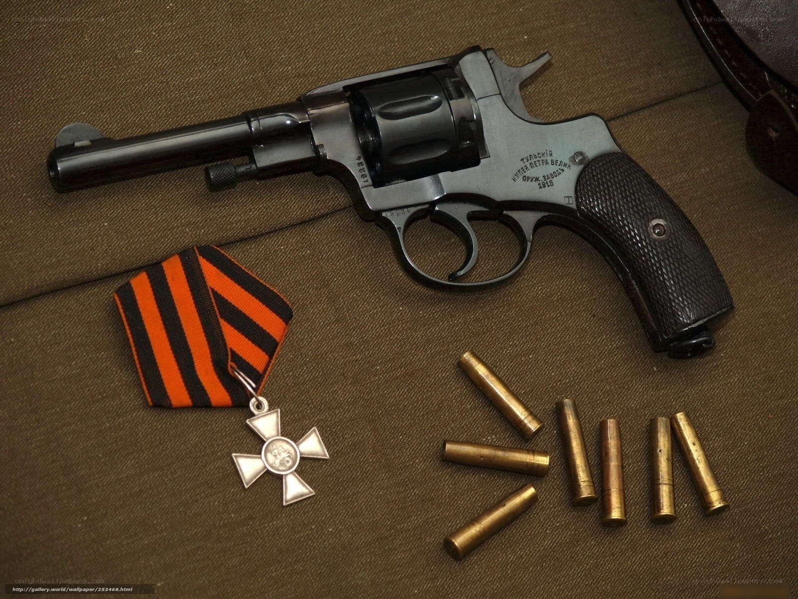 Revolver with medal and bullets