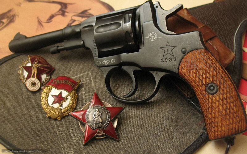 Revolver with Soviet badges