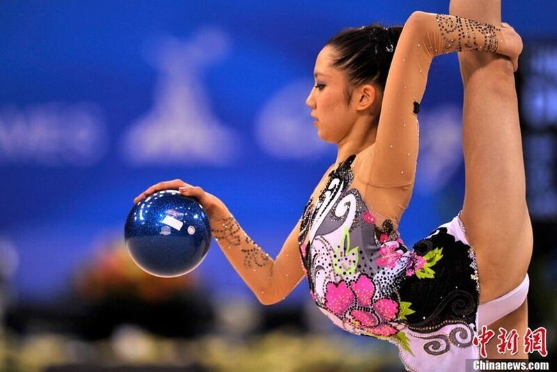 Rhythmic Gymnast with Ball — Blue, Focused