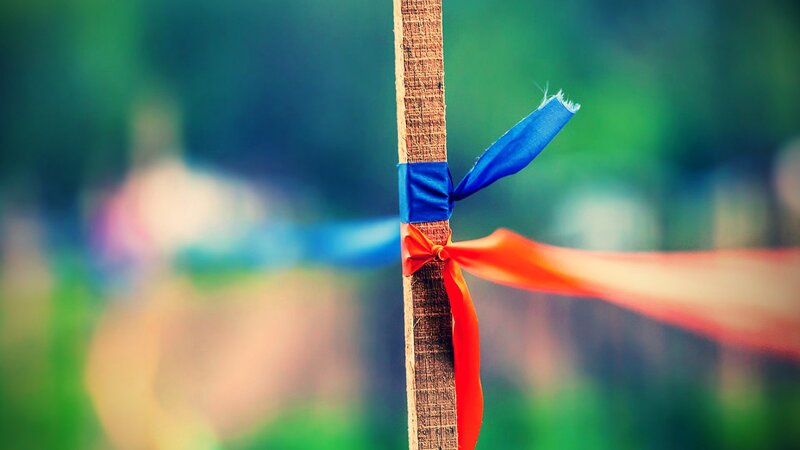 Ribbons tied to a wooden post
