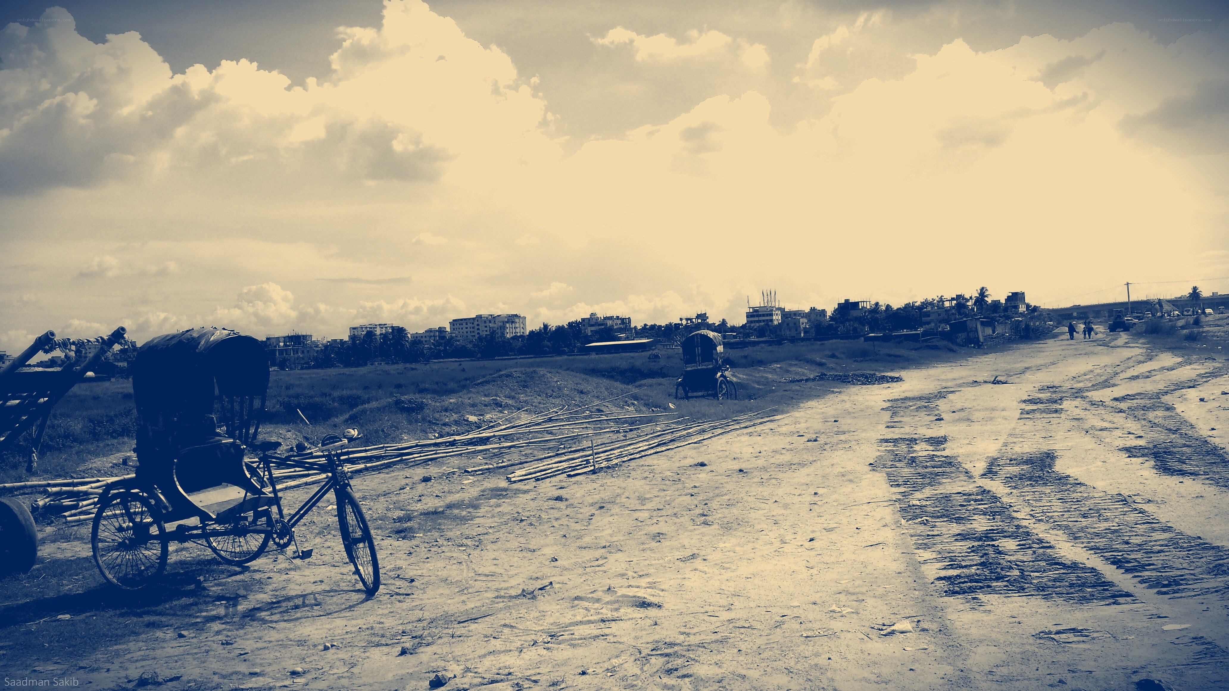 Rickshaws on a muddy road