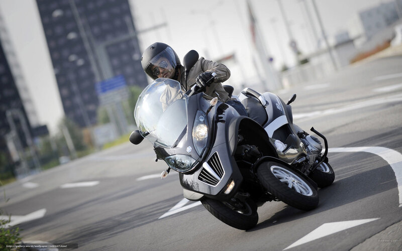 rider on a three-wheeled motorcycle