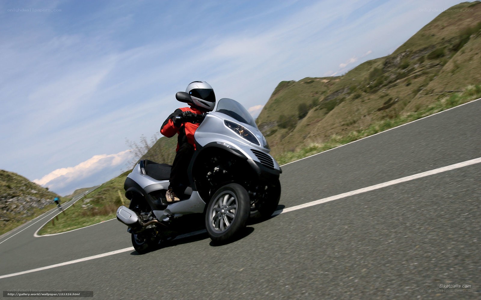 Rider on a three-wheeled scooter
