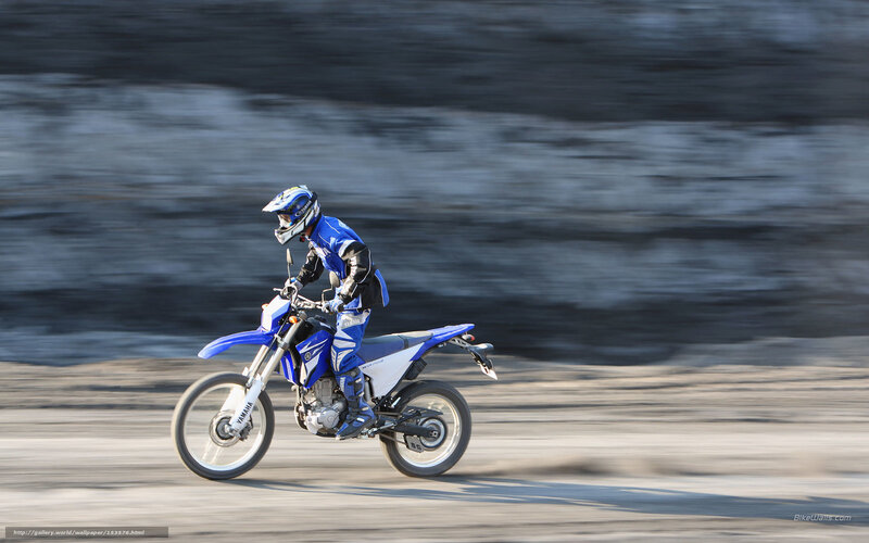 rider on blue motorcycle