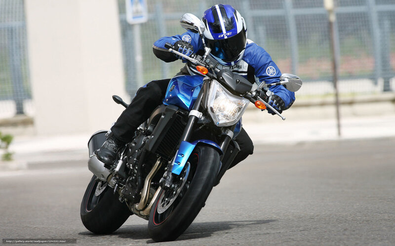 rider on blue motorcycle