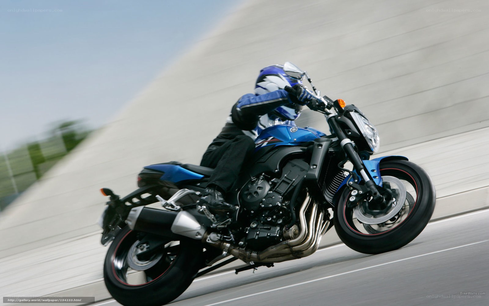 rider on blue motorcycle