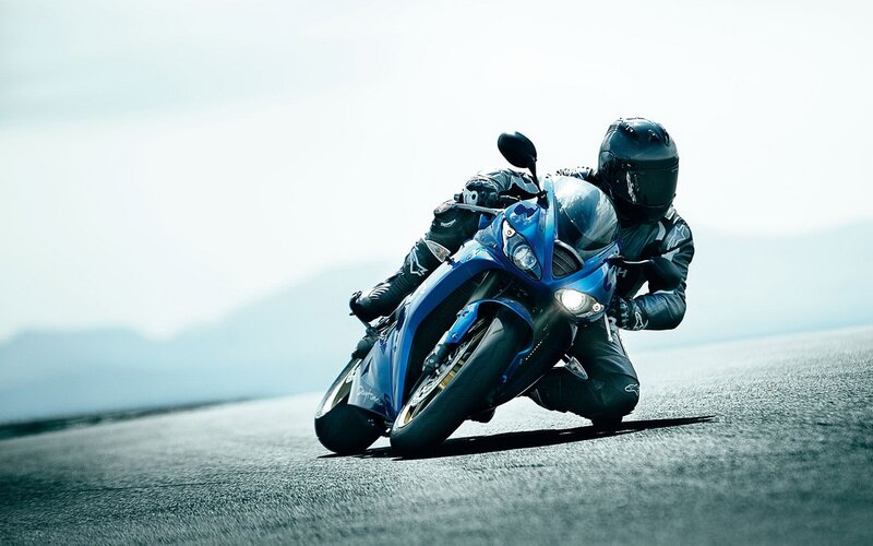 rider on blue motorcycle
