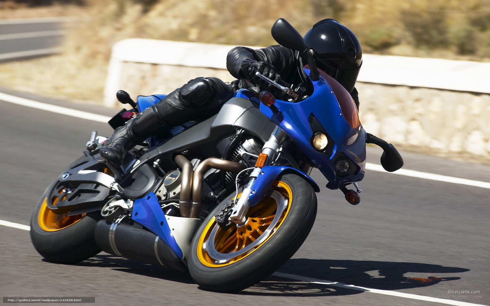 rider on blue motorcycle