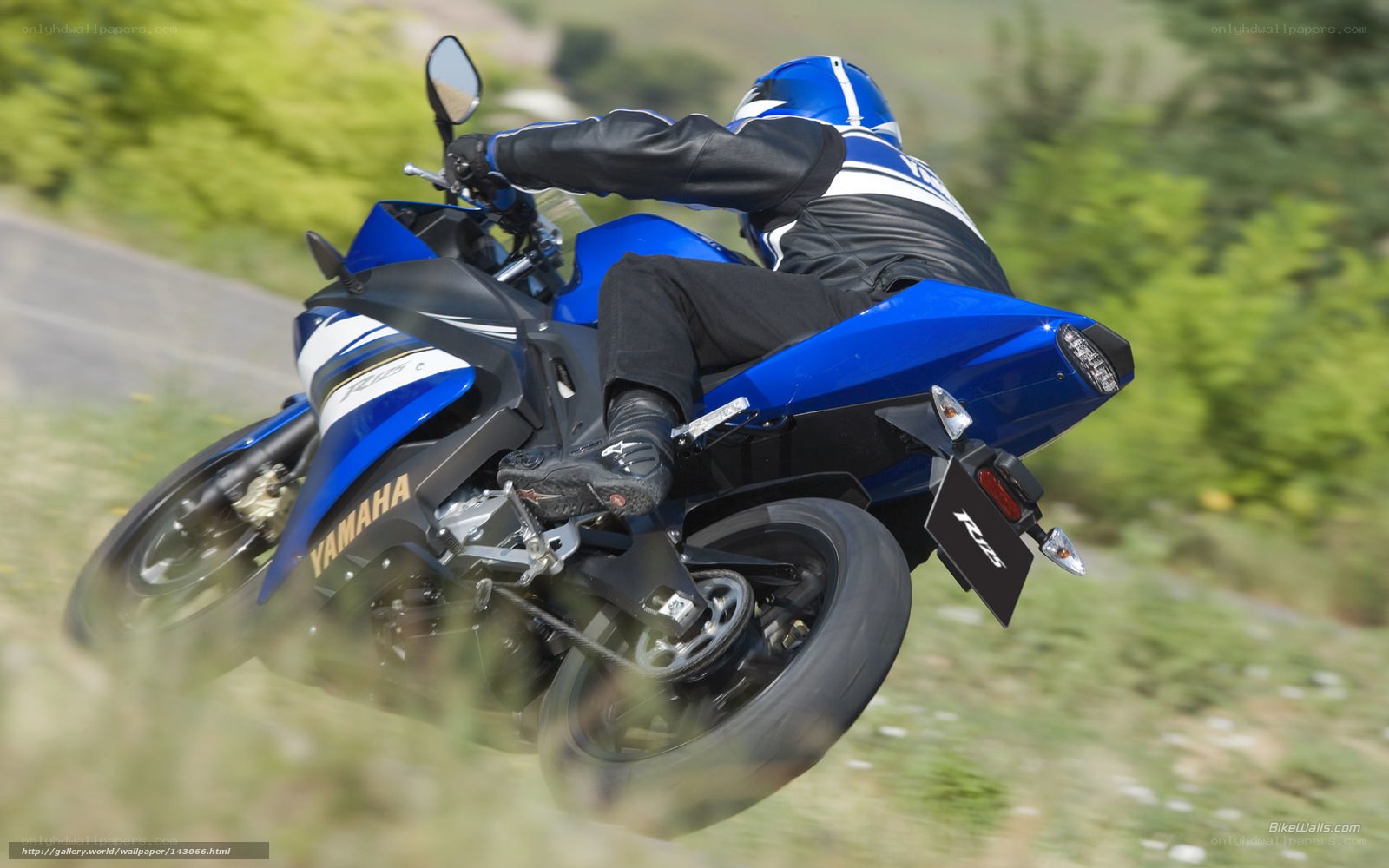 rider on blue motorcycle