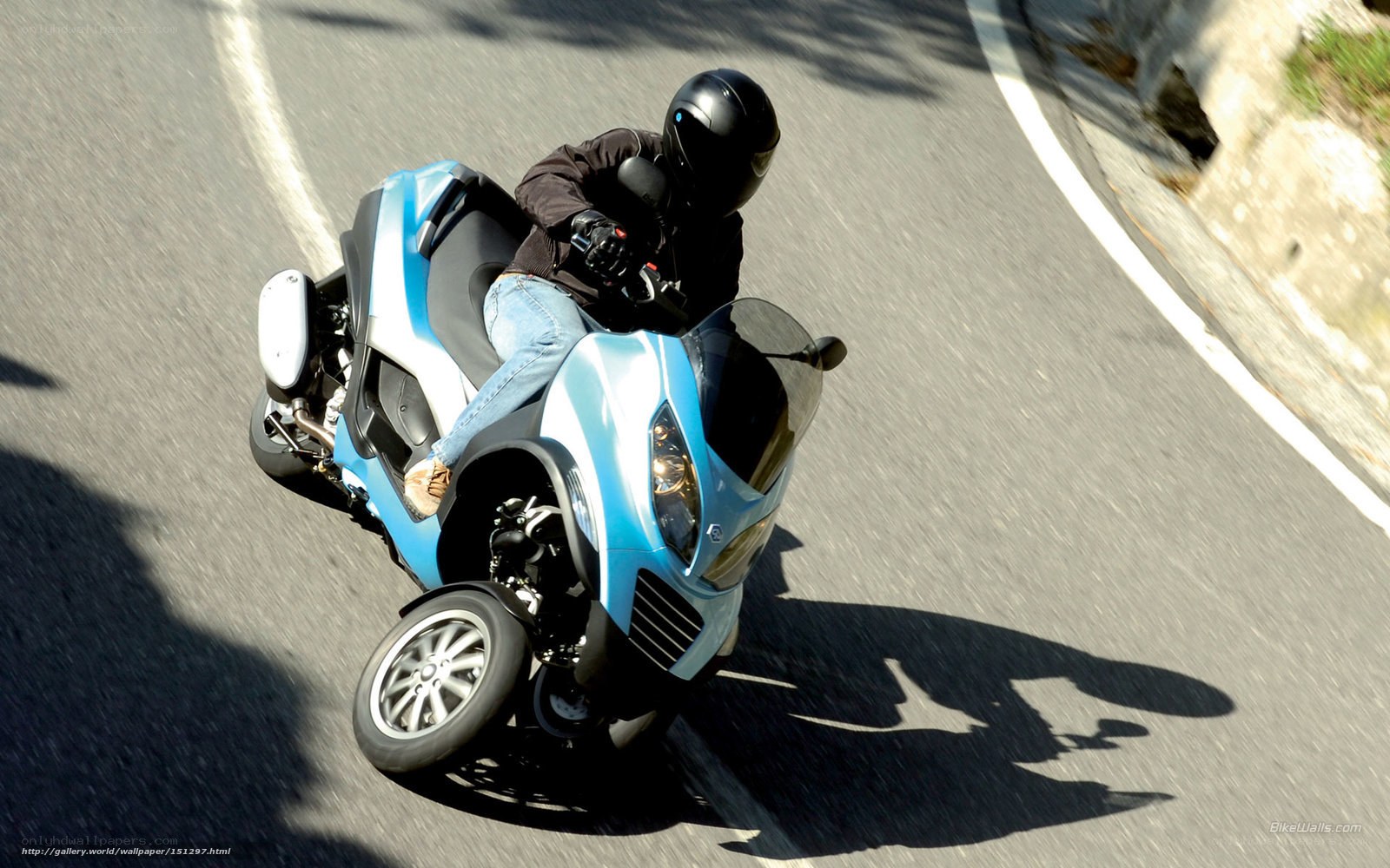 rider on blue scooter