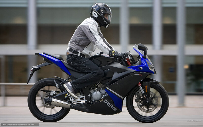 rider on blue sport motorcycle