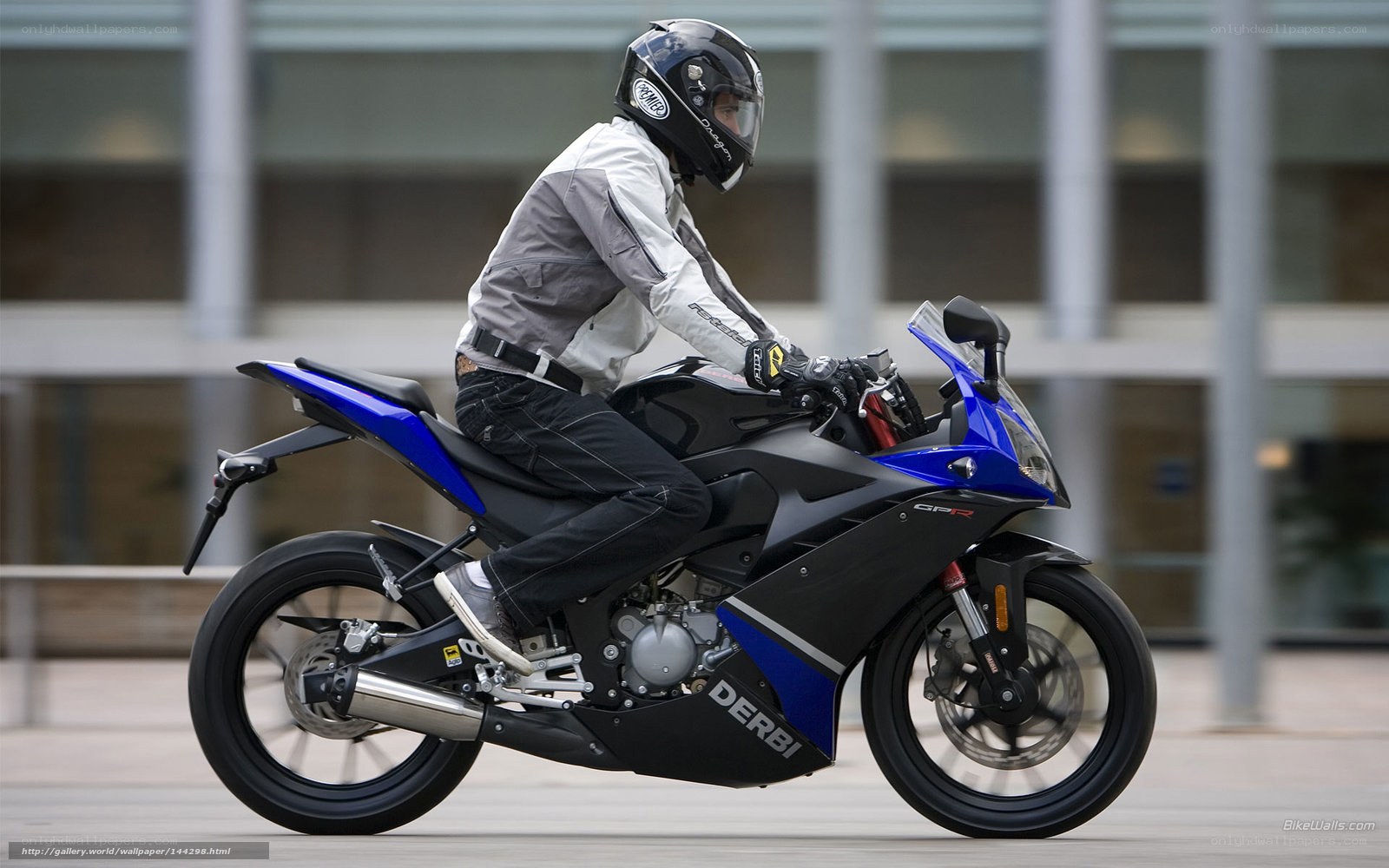 rider on blue sport motorcycle