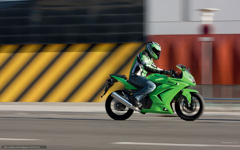 rider on green motorcycle