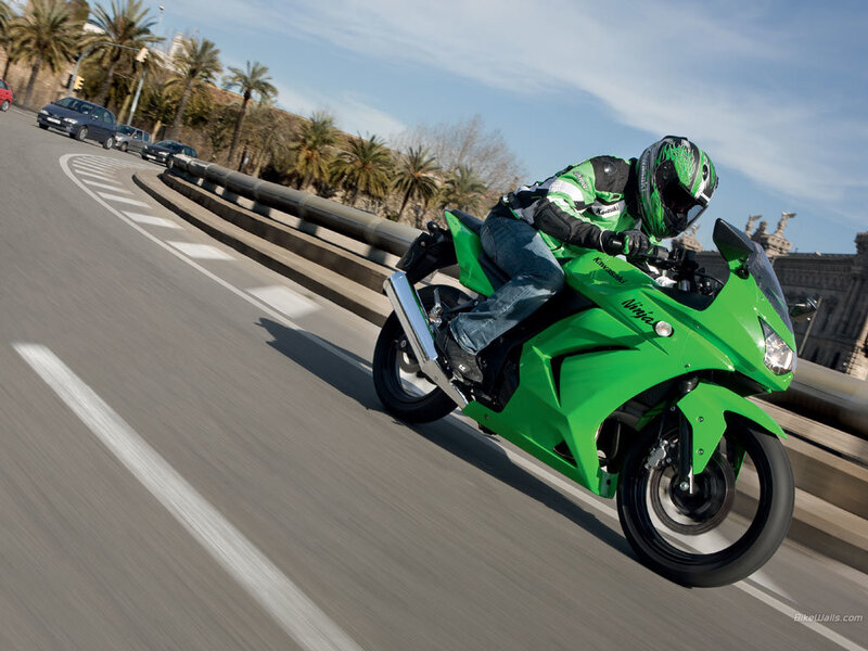 rider on green motorcycle