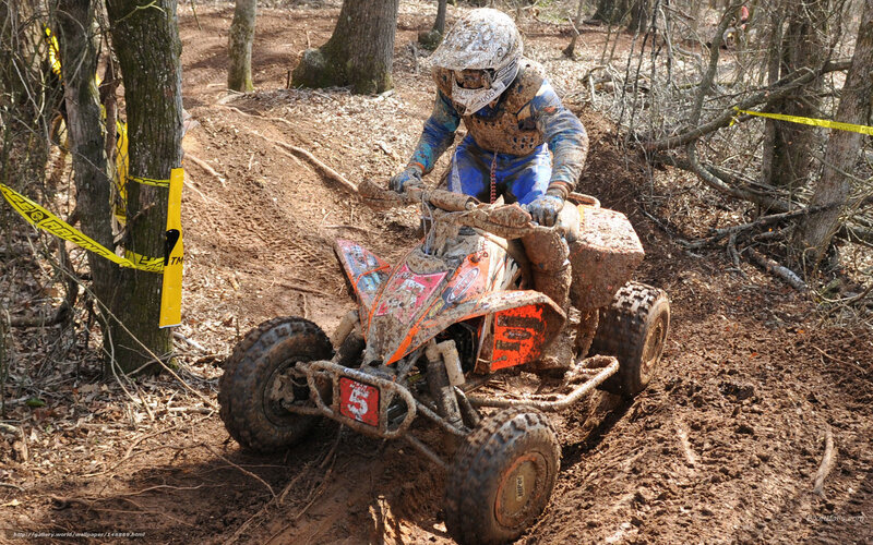 Rider on Muddy ATV — Brown, Active