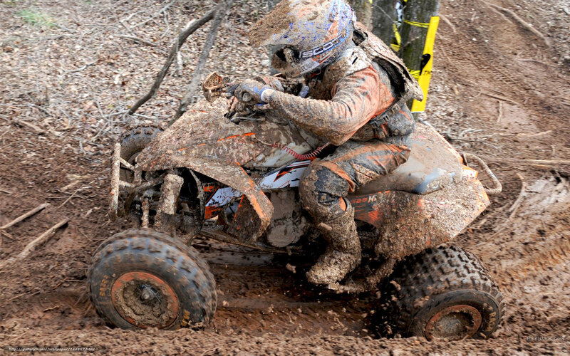 Rider on Muddy ATV — Brown