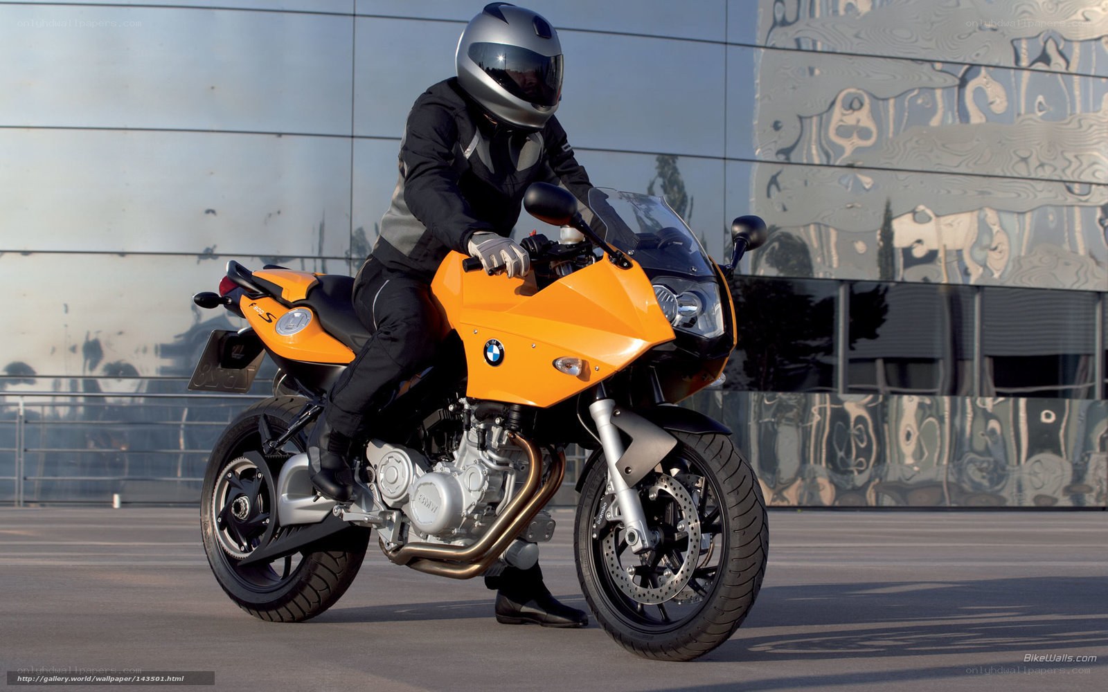 Rider on orange BMW motorcycle