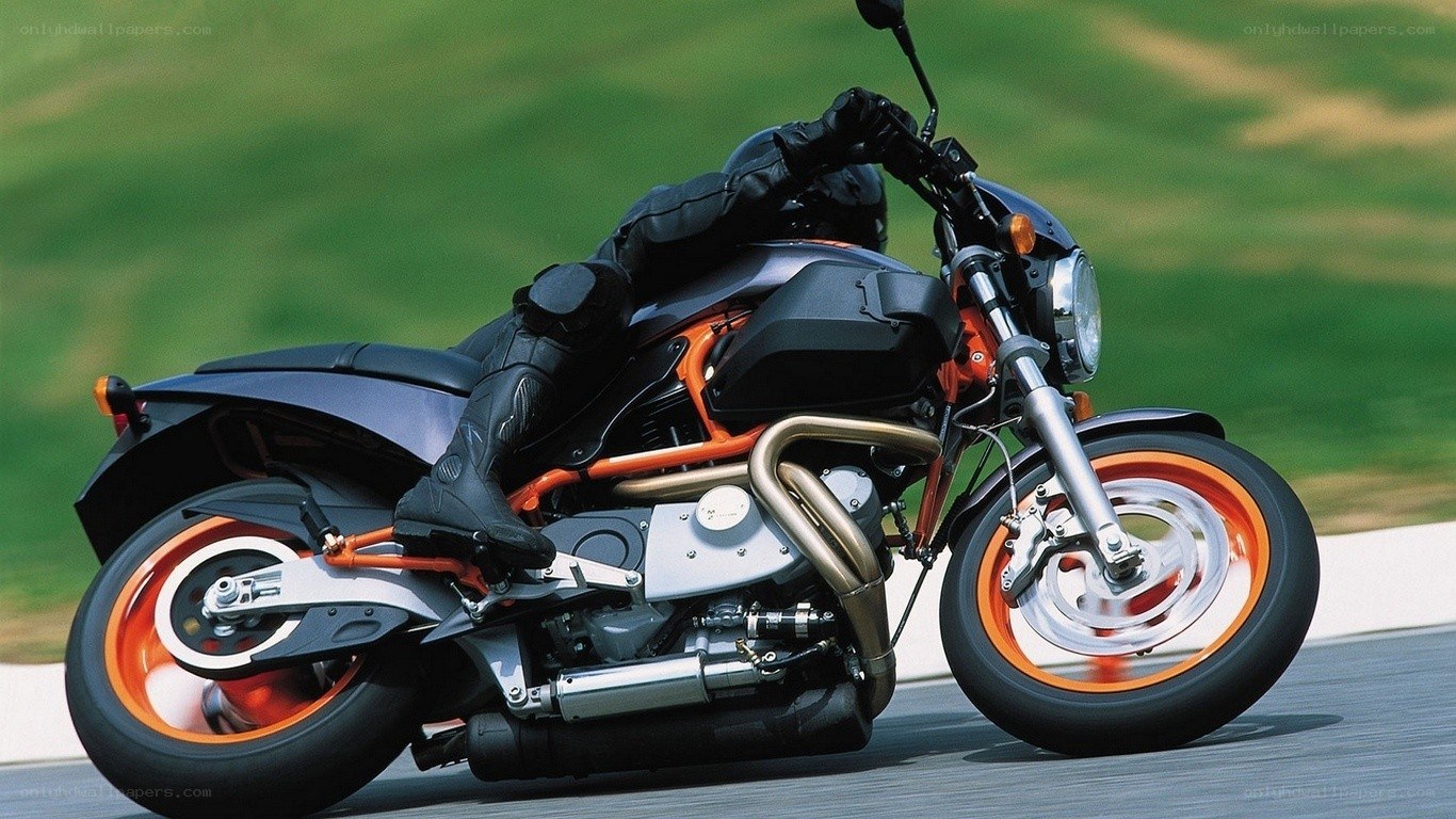 rider on orange motorcycle