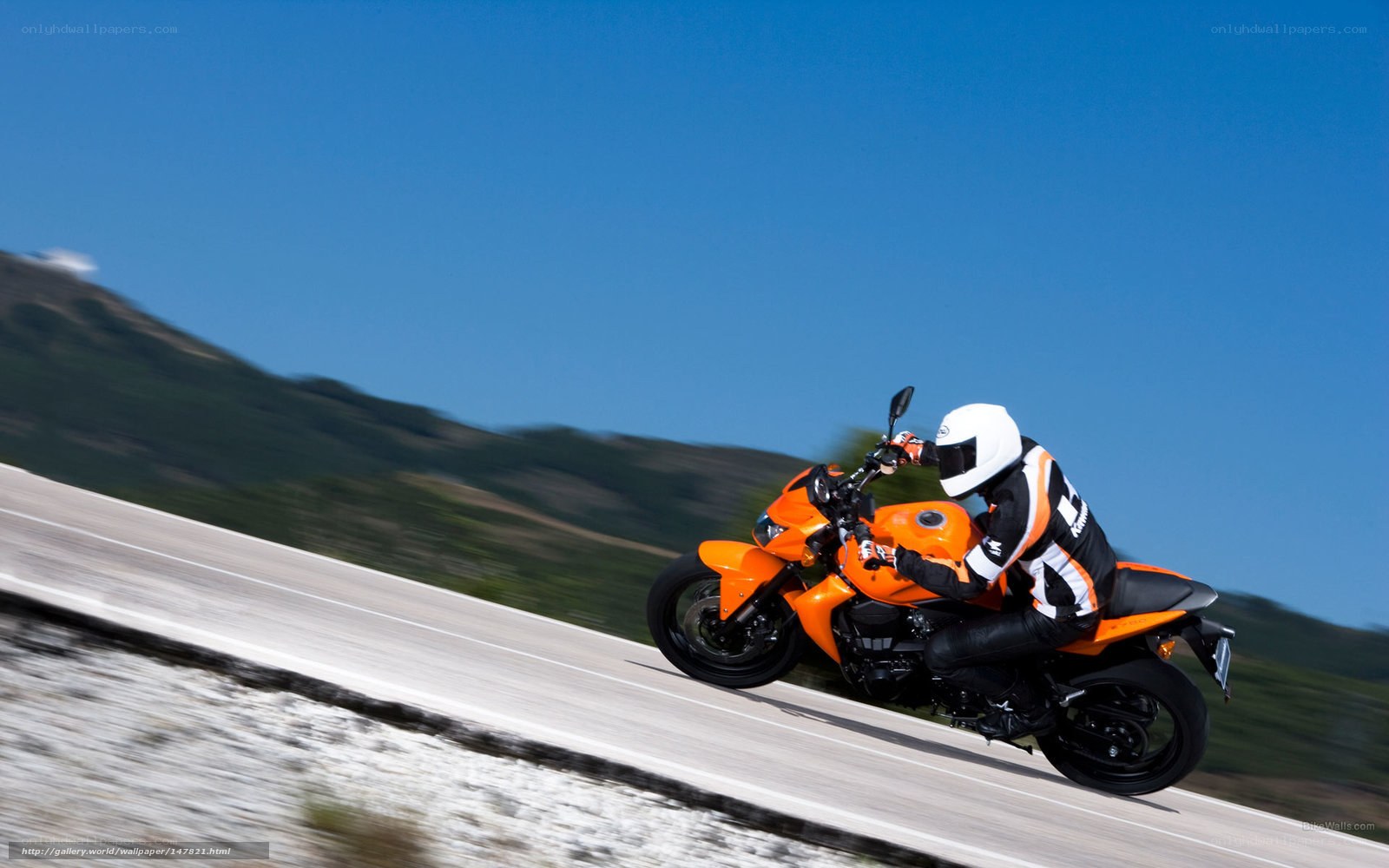 Rider on orange motorcycle