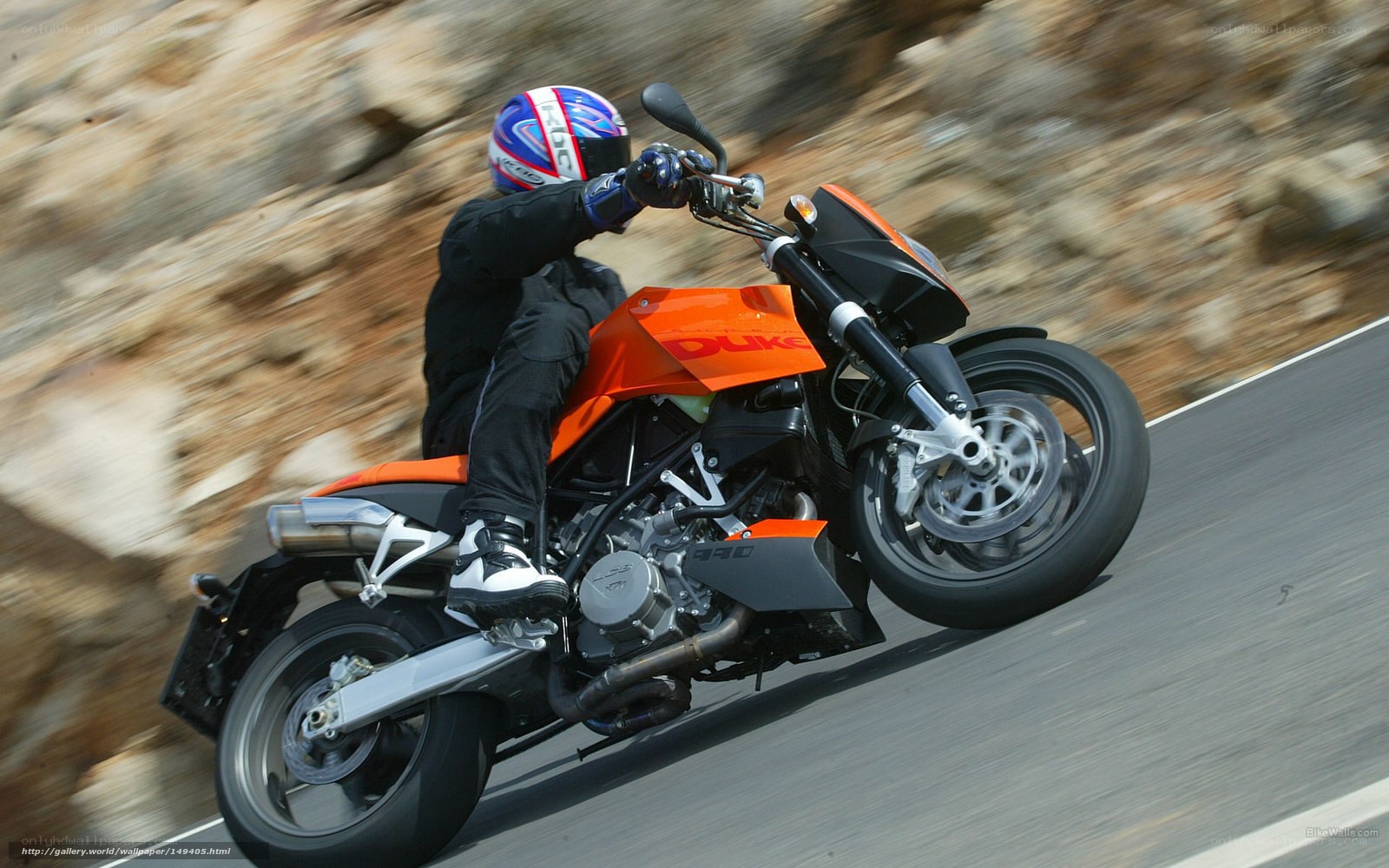 rider on orange motorcycle