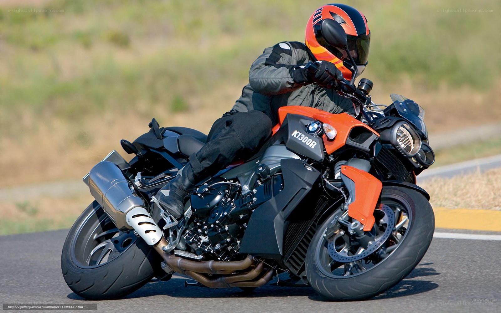 rider on orange motorcycle
