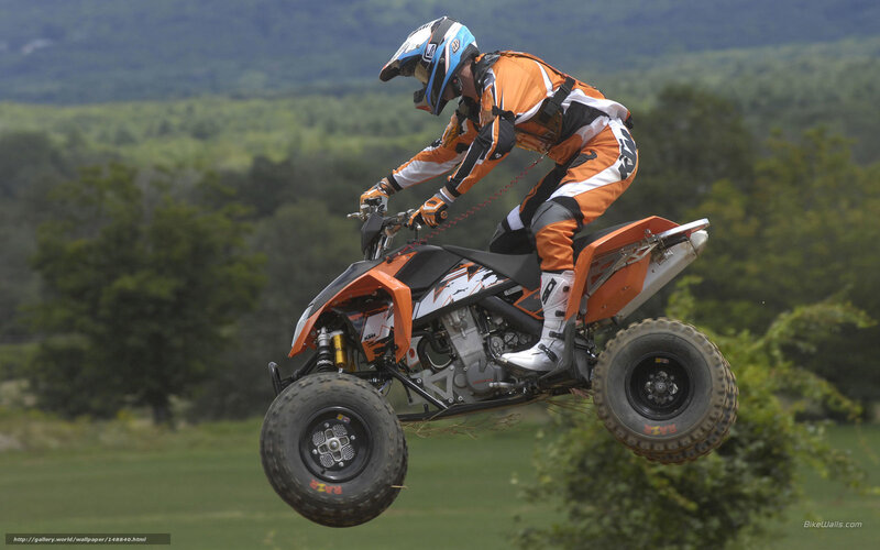 Rider on Orange Quad Bike — Dynamic