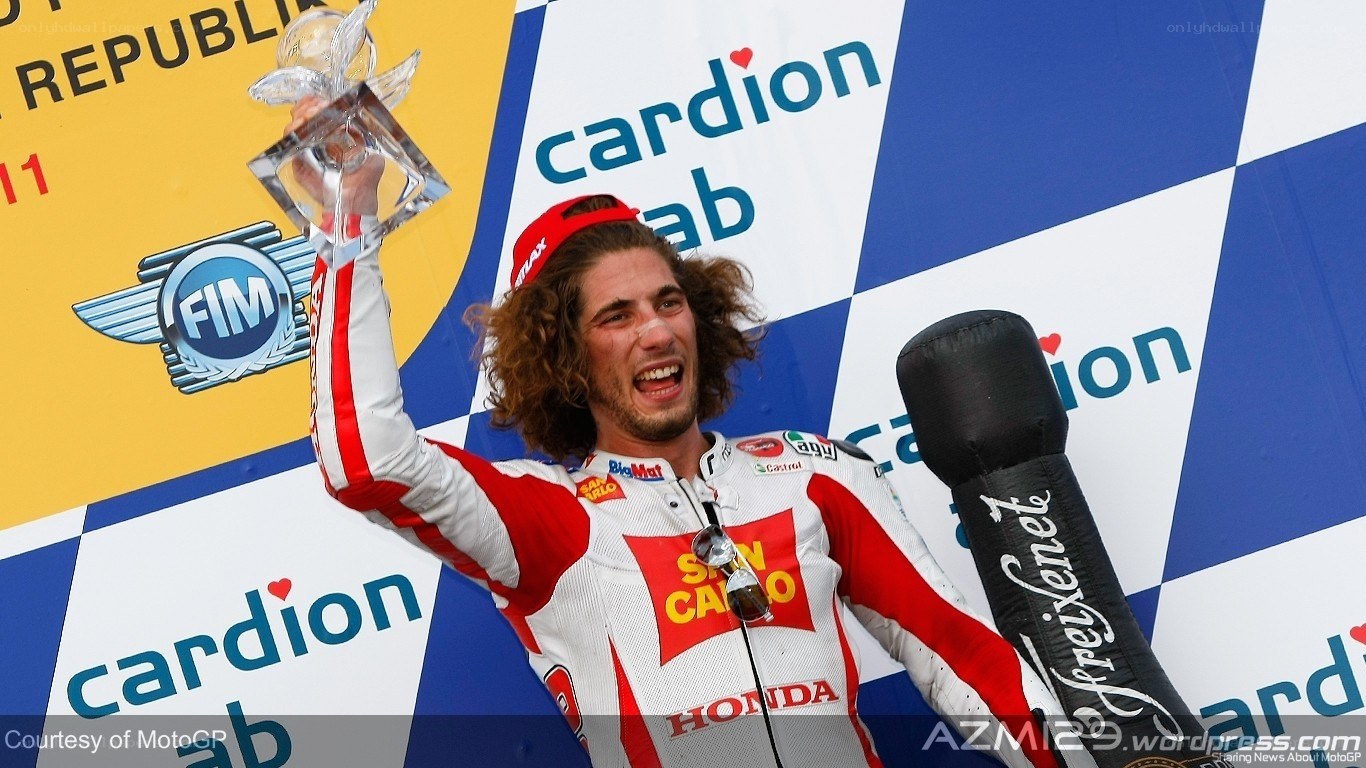 rider on podium celebrating