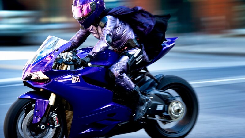 rider on purple motorcycle