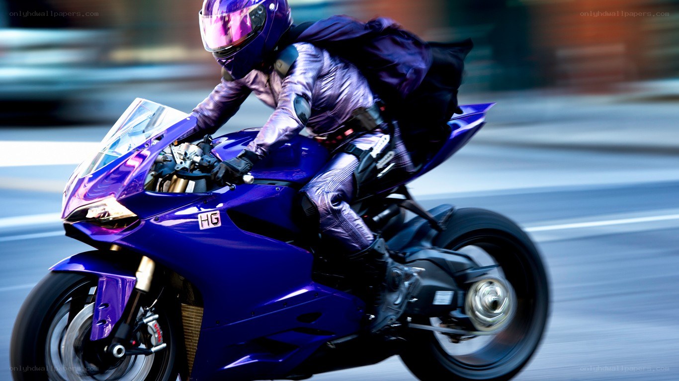 rider on purple motorcycle