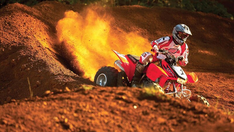 Rider on Red ATV — Dynamic, Sunset, Photograph