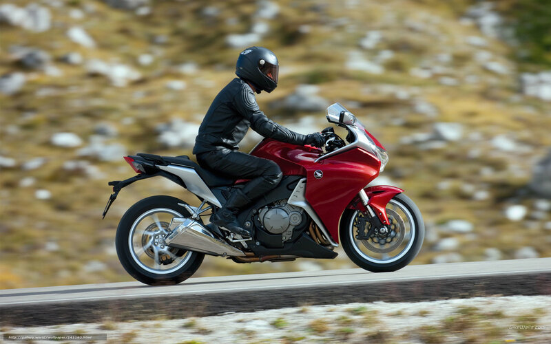 rider on red motorcycle