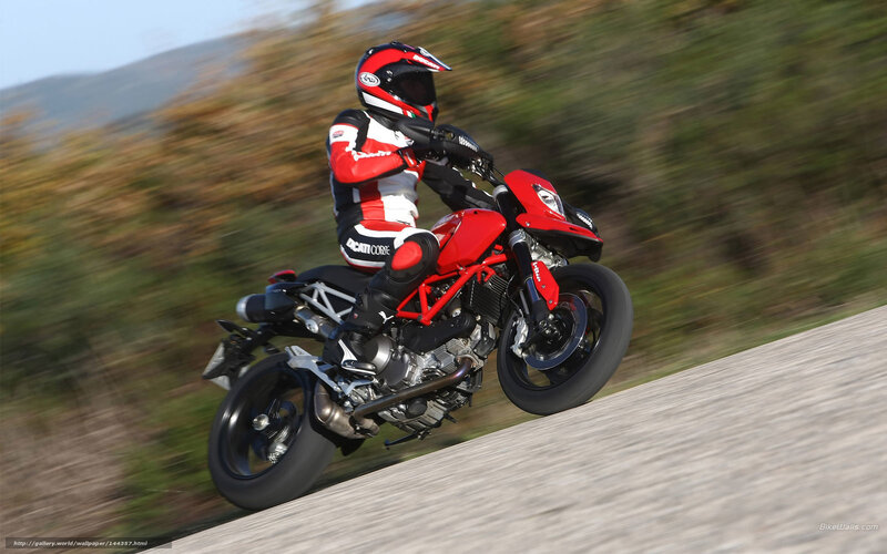 rider on red motorcycle