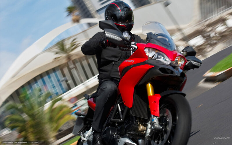 rider on red motorcycle