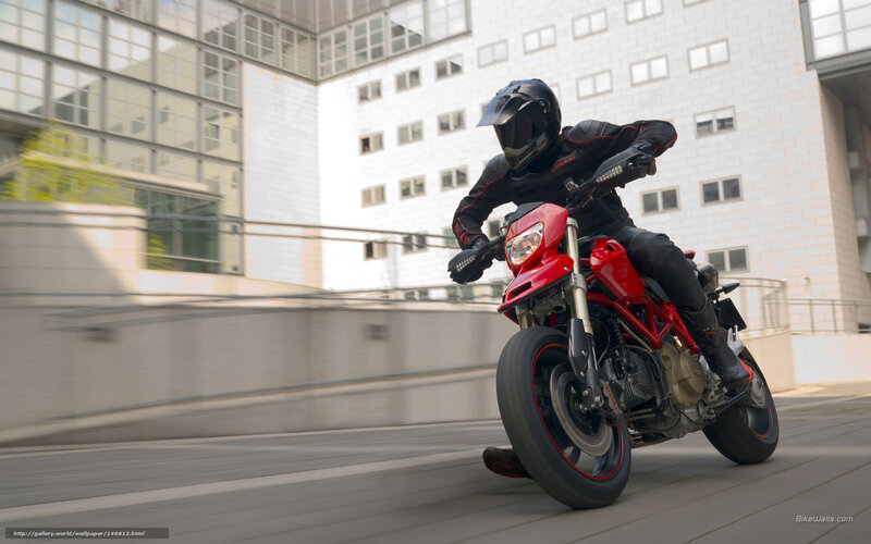 Rider on red motorcycle in city