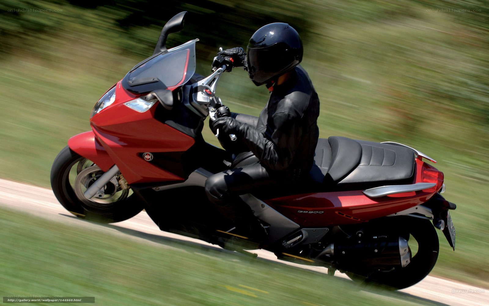 Rider on red scooter