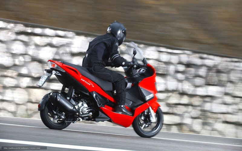 rider on red scooter