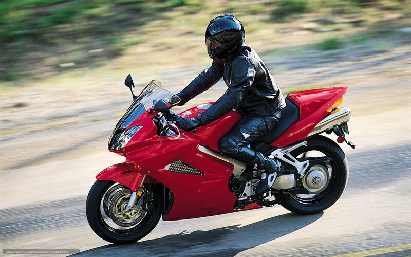 rider on red sport motorcycle